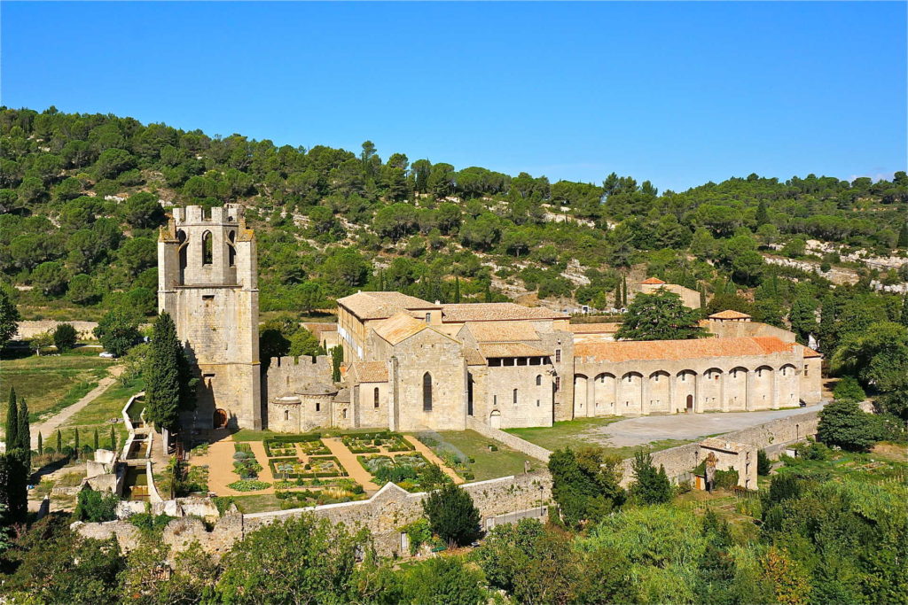 This is a top-view drone photo of Lagrasse Abbey and the south transept in dire need of restoration. Lagrasse Abbey is one of the most prestigious religious monuments in the South of France. Revive Lagrasse Abbey