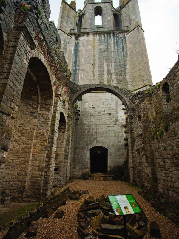 This is a bottom-view photo of Lagrasse Abbey south transept. Lagrasse Abbey is located in the South of France about 20 miles south-east of Carcassonne, in the Aude department of Languedoc-Roussillon. Abbaye Sainte-Marie de Lagrasse